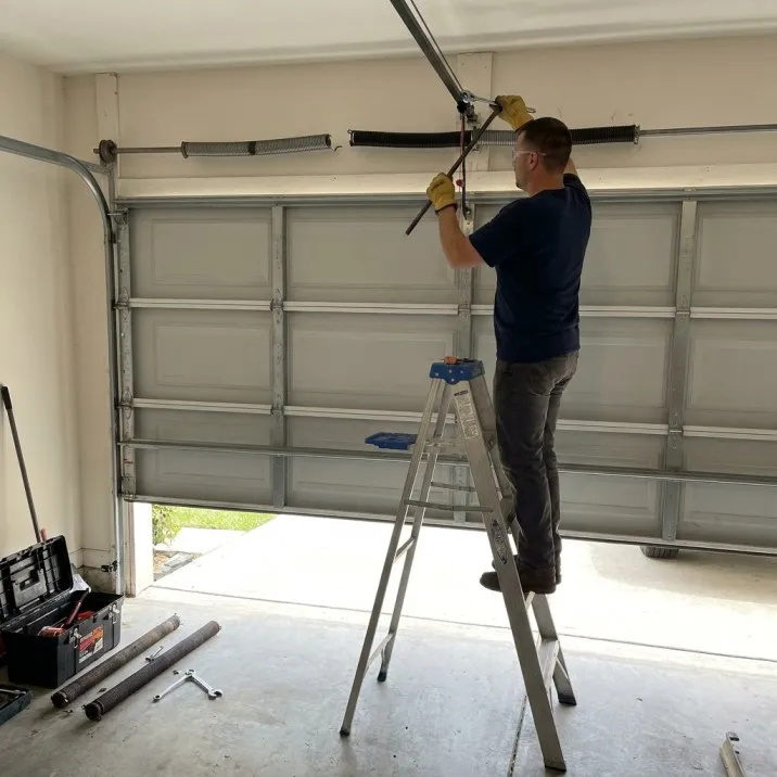 Broken garage door spring repair in Northport Alabama