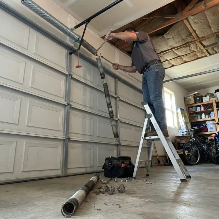 Garage door spring repair before service in Tuscaloosa