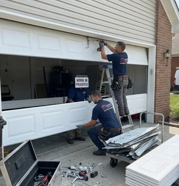 Garage door panel replacement during installation